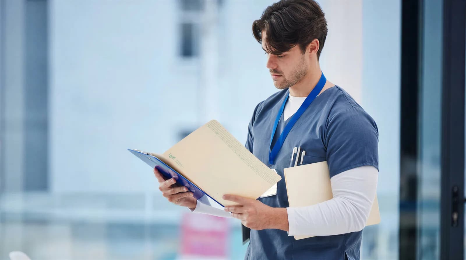 A doctor reading a patient's history before the consultation